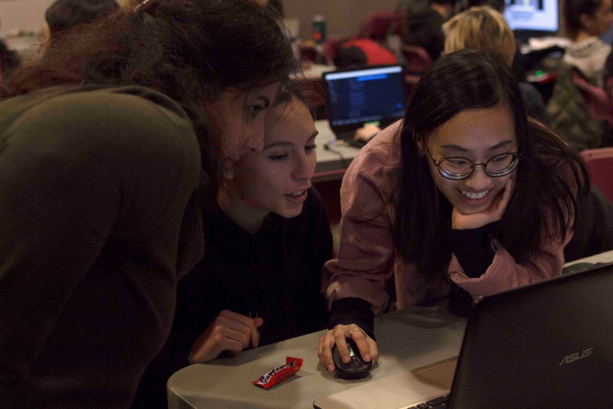 Jam participants look at their laptop