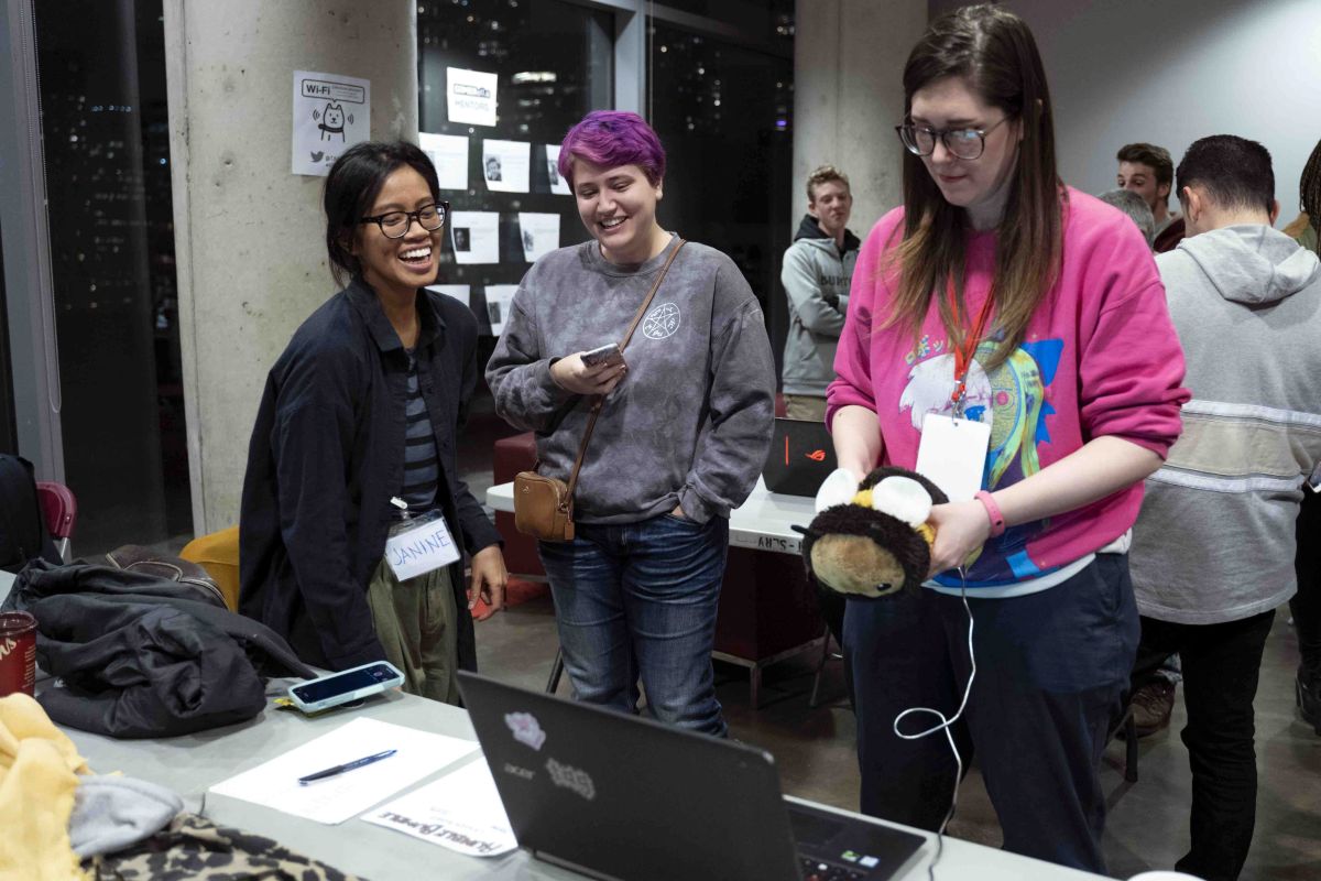 Co-founder Gina Hara playtests a game using a bee plushie as a controller