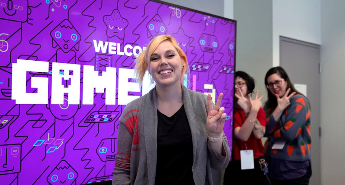 A jam participant and organizers pose for the camera